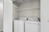 washer and dryer in B1 renovated floorplan at Timber Flats with shelving white