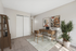 Virtually staged office at Bridge Lane with desk, bookshelves, plant and art