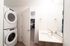 Bathroom at Orrin with laundry behind the door