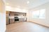 Urban One-Bedroom at Orrin with a kitchen and living room and view into bedroom space