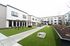 Outdoor turf area at Orrin with turf area and cornhole