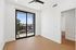Unfurnished living room at ASA with a sliding glass door out to the patio