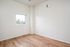 One Bedroom at Lyra Apartments - bedroom with window and hardwood floors