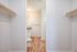 One Bedroom at Lyra Apartments - walk-in closet with shelves and rods to hang clothes