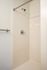 One Bedroom at Lyra Apartments - Bathroom with walk-in shower and towel bar