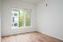 One-Bedroom at Lyra Apartments - living room with window and hardwood floors