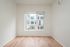 One-Bedroom at Lyra Apartments - living room with window and hardwood floors