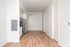One-Bedroom at Lyra Apartments - view from living room into the kitchen and entryway