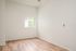 One-Bedroom at Lyra Apartments - bedroom with window, ceiling fan and hardwood floors