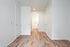 One-Bedroom at Lyra Apartments - bedroom with view into the closet and bathroom