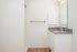 One-Bedroom at Lyra Apartments - bathroom with grey counter and hardwood floors