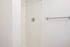 One-Bedroom at Lyra Apartments - walk-in shower with towel rod