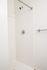 One-Bedroom at Lyra Apartments - walk-in shower with towel rod