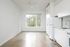Cassi Apartments - kitchen into the living room with concrete floors