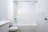 Cassi Apartments - bathroom with shower/tub white countertops and cabinets