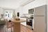 Virtually staged kitchen at Lyra with a dining table and chairs