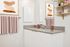 Virtually staged bathroom at Lyra with art, towels, and decor