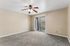 Living Area with carpet, ceiling fan, and patio.