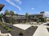 Sunny courtyard view of modern apartment units at Lakeside Place.