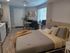 Cozy bedroom area with large window at Lakeside Place in Bend.