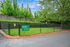 Dog park with greenery and fence.