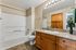 Bathroom with sink, shower, tub, and toilet.