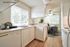 Virtually staged apartment kitchen displaying functional counter space at CAMPBELL PARK.