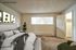 Virtually staged bedroom showcasing layout possibilities with a large bed at CAMPBELL PARK.