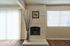 Bright apartment interior with a painted fireplace at CAMPBELL PARK.