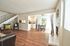 Open-concept main living area with faux-wood like flooring at CAMPBELL PARK.
