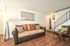 Furnished multi-level living room showing a staircase entry at CAMPBELL PARK.