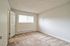 Vacant bedroom with light-colored walls and carpet flooring at CAMPBELL PARK.