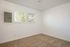 Bedroom with window and carpet.