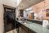 Contemporary resident clubhouse bar and kitchen counter space at Berkeley Heights Apartment Homes.