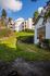Manicured grass hillside and building walkway at Berkeley Heights Apartment Homes.