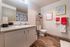 Clean bathroom space displaying a vanity sink and towel rack at Berkeley Heights Apartment Homes.
