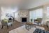 Spacious living area with plush carpets and modern furniture at Berkeley Heights Apartment Homes.