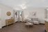 Virtually Staged living room at Orchard Mesa with a couch, coffee table and entry table