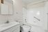 Bathroom at Orchard Mesa with white sink and cabinets and a shower/tub combo