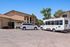 Orchard mesa bus and ADA van with Orchard Mesa branding