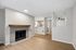 Living Room at Timber Flats with wood floors and view into kitchen and entryway