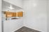 dining room in 2x1 floorplan with view into the kitchen