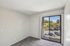 primary bedroom at ventura villas with sliding glass doors and a patio and carpet