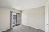 primary bedroom at ventura villas with sliding glass doors and a patio and carpet