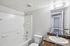 bathroom at ventura villas 2x1 with tub/shower and toilet and shower