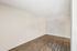 Corner of a Deer Valley Village living space featuring wood-style vinyl flooring and neutral paint.
