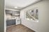Deer Valley Village kitchen and dining space with large window overlooking exterior stairs.