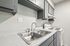 Close-up of a double stainless steel sink and laminate countertop at Deer Valley Village.