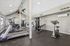 Gym at Silver Creek with treadmill, stationary bike and other equipment