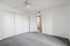 Bedroom with closet and ceiling fan and carpet